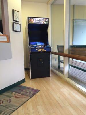 Old school arcade game in the waiting area.