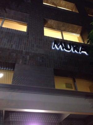 MURA sign above the front door to the condo/apartment building