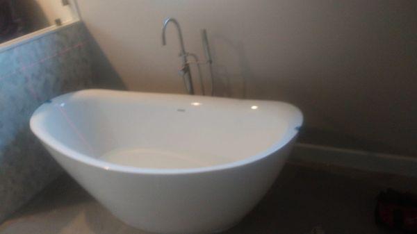 Completion of newly installed free standing tub with fixture In Saratoga, CA