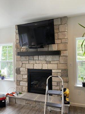 55" TV mounted on engineered stone veneer