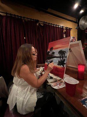 My mom in the process of painting her picture