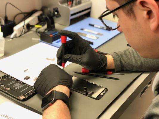 One of our techs completing an iPhone screen repair.