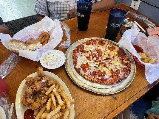 Hush puppies, rolls, slaw, chicken tender plate, pizza and nuggets