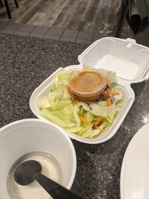 Soup and salad served in styrofoam