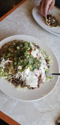 Beef taco salad no tortilla chips guacamole and sour cream