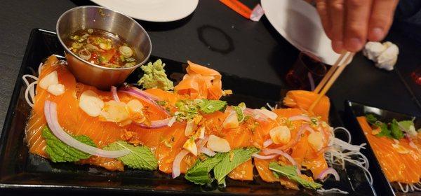 Special from Chef: Spicy salmon sashimi drizzled in Jeow som.