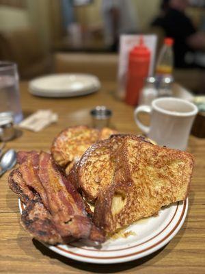 Challah bread French Toast, Thick bacon (3pcs) and Breakfast Sausage (2pcs).