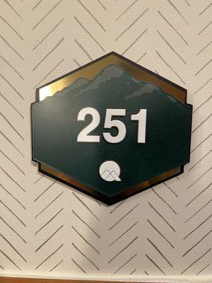 Changed the unique iron animal themed room numbers to cheap, common plastic ones.