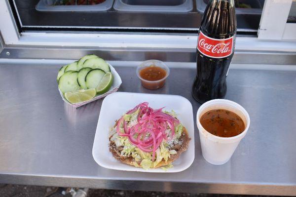 Tostadas come with our consomé!
That is a hard shell open faced taco with soup!