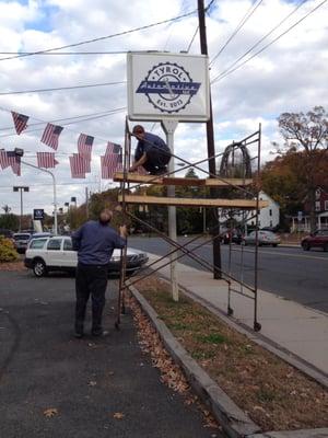 Tom and Oliver erecting new road sign 10/28/13