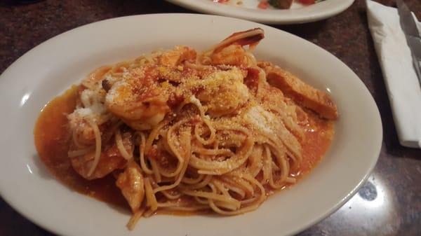 I made my own dish. Shrimp and chicken sautéed in red sauce with pasta