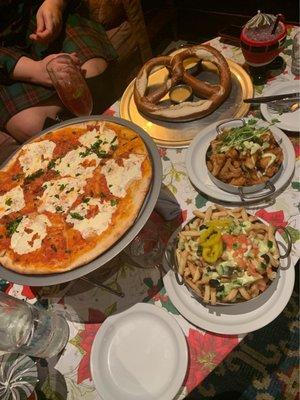 Clockwise- Pretzel with cheese and mustard, fried cauliflower, tzatziki fries (our favorite), and a margarita pizza.