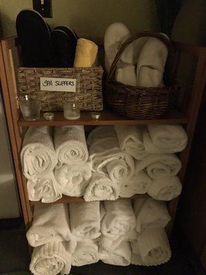 Towels and spa slippers waiting for guests