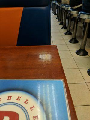 Walk in this place, surprised to see, bar stools all in a row..