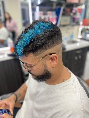 Teal part and disconnected haircut