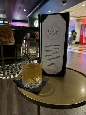 A Big Jimmy cocktail next to the menu