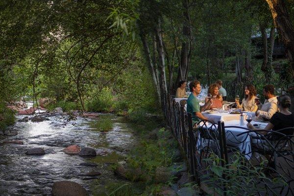 Guests dining creekside at Cress on Oak Creek