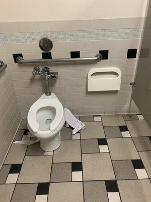 Not only is the paper toilet seat cover empty, there's no toilet to even create a make shift seat cover or to wipe your ass. Pathetic