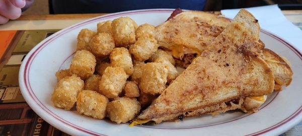 Turkey parmesan sandeich with tots