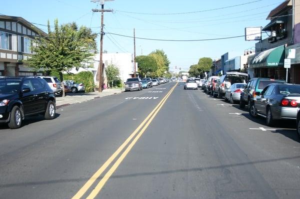 The Salon is EASY TO MISS - You can barely see driving north on Laurel. The blue car on left is parked in front of it.