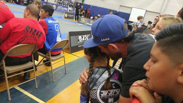 Jason front row to coach and support his student at a tournament