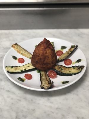 Sicilian Rice Ball filled with chopped meat and peas.