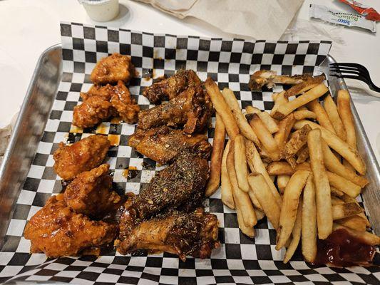 Half and half Thai chili boneless and Jamaican Jerk regular wings and fries