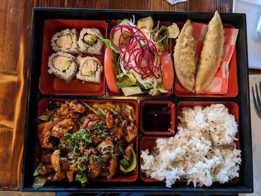 Chicken Teriyaki, California Sushi Roll, fresh tomato's and salad with ginger dressing, veggie dumplings, and steamed white rice.