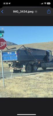 Over loaded Republic trash dumpster at 93 and 82. Rocks broke my windshield and they ignored my request for a new windshield.