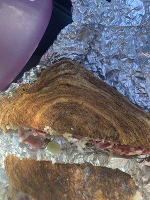 Rueben is a thin grilled cheese like sandwich at the price of a Reuben