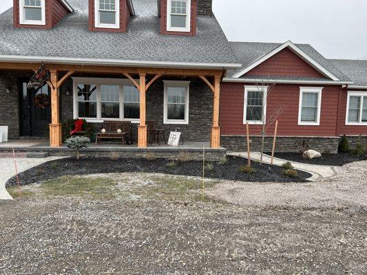 New planting a small sidewalk and a nice retaining wall put the finishing touches on this beautiful home.