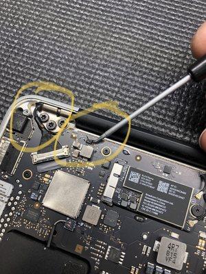 Liquid damage, burned chip on MacBook Pro