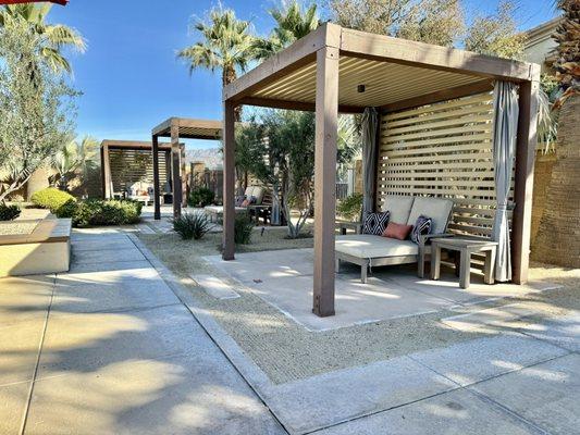 Cabanas by the pool at Mediterra Apartments in La Quinta, California.