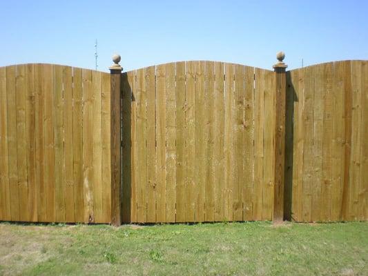 6-foot high, arched with 6x6 posts and ball tops