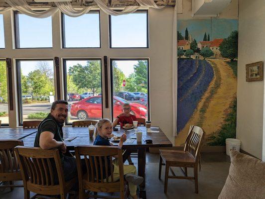 Secondary dining area has a huge table. Decor is cute!