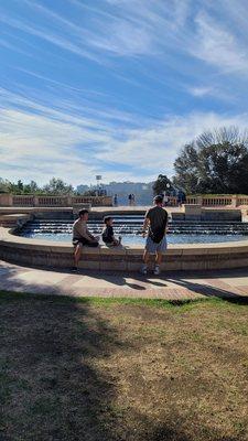 At the fountain near Powell library with my boys.