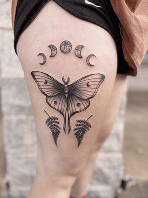 Luna moth tattoo on upper right thigh