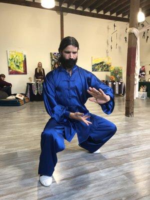 Matt Branstetter provides a Tai Chi demonstration during an art fair