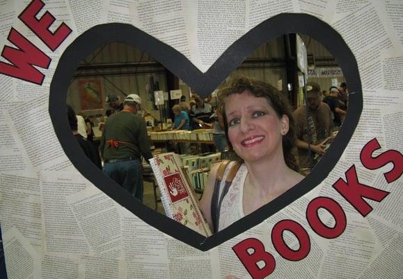 VNSA made this photo frame for us (made out of cardboard).  I am holding it up. Reminds me of Polaroid.  Yes, I (heart) books ;)