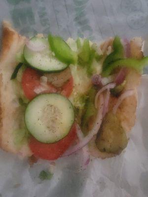 A Veggie Delight that was made with bread and salad. Staff argued it doesn't include free double cheese. Truly a horrible sandwich!