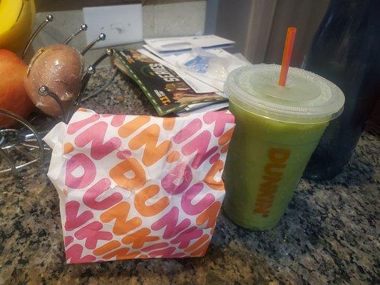 Iced matcha latte and a couple doughnuts