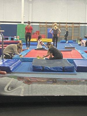 Photo of instructors scrubbing mats!!