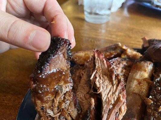 That's not a burnt end. That's just dried out, crispy brisket. Either the trim was poor, or the cook when awry.