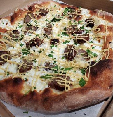 Oktoberfest special, The Wurst pizza: Olive oil base, fresh mozzarella, bratwurst, sauerkraut, Dijon mustard, and parsley.