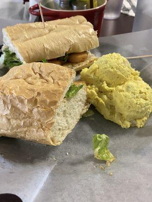 Fried shrimp po'boy with potato salad. The French bread is from New Orleans.