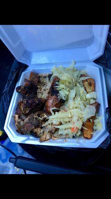 Jerk chicken with cabbage and rice and beans