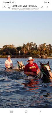 Myself & my husband swimming on our horses..Snooki & Dory!