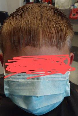 This is what the so called stylist did. Chopped his hair! This was taken today at my stylist after they wetted his hair and combed it down.