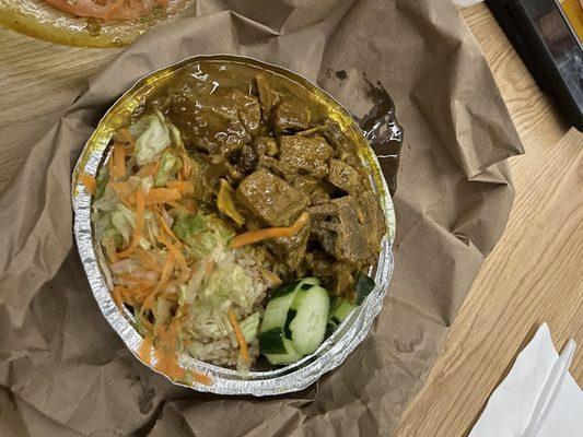 Curry Goat, Rice and Peas, Salad.