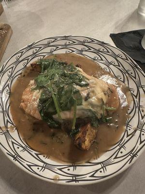 Chicken with potatoes covered with prosciutto and mozzarella in a sage sauce